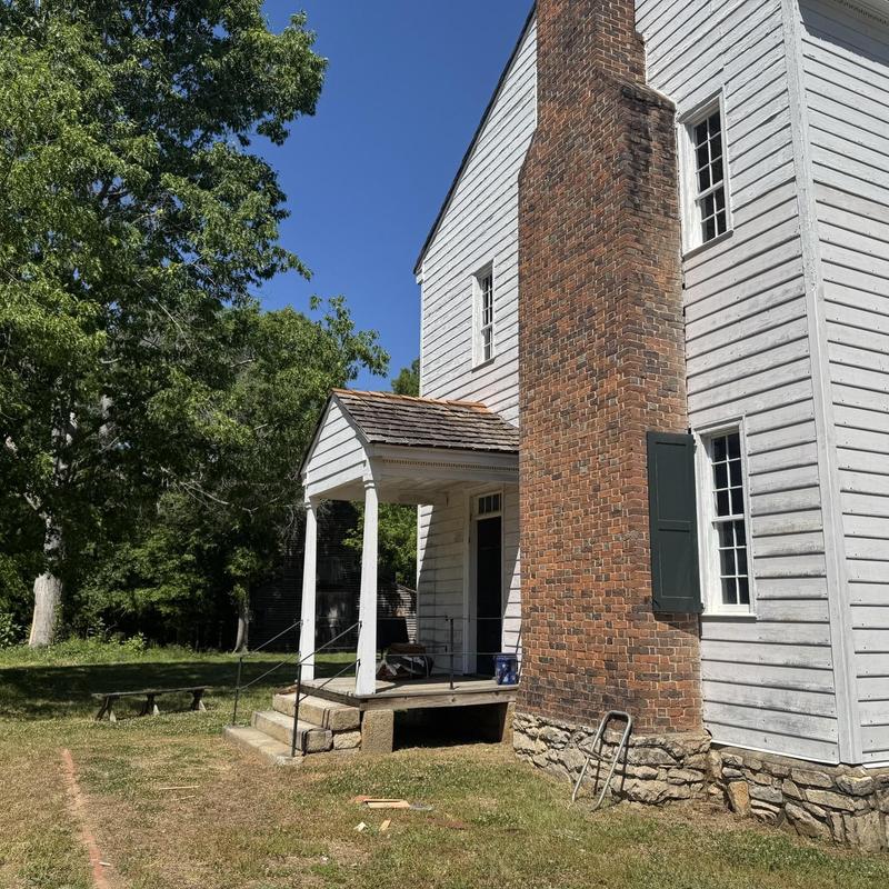 Cedar shake porch roof with repaired flashing and wood rot