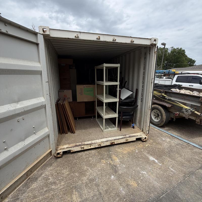 Storage container with boxed and stacked furniture
