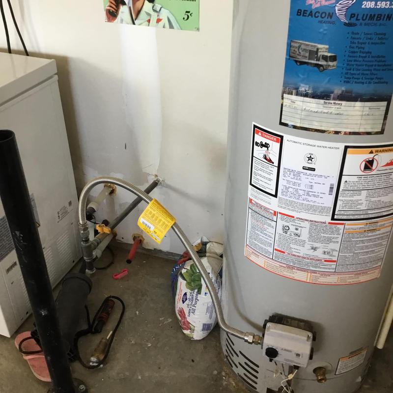 Natural gas water heater with expansion tank and piping