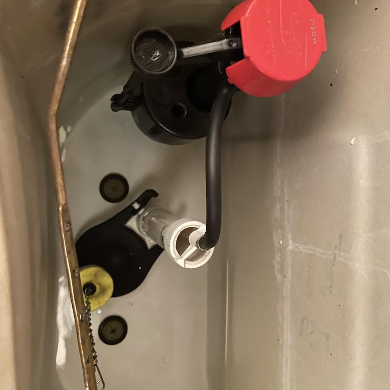 Toilet tank fill valve and flush mechanism inside tank