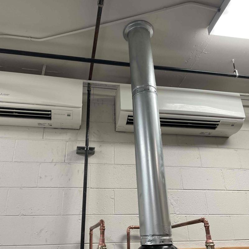Commercial gas water heater vent pipe installation