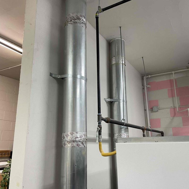 Commercial gas water heater vent and gas line installation