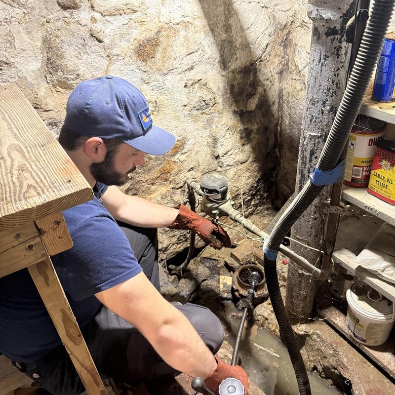 Main drain pipe clog removal by plumber in basement Main drain pipe clog removal by plumber in basement