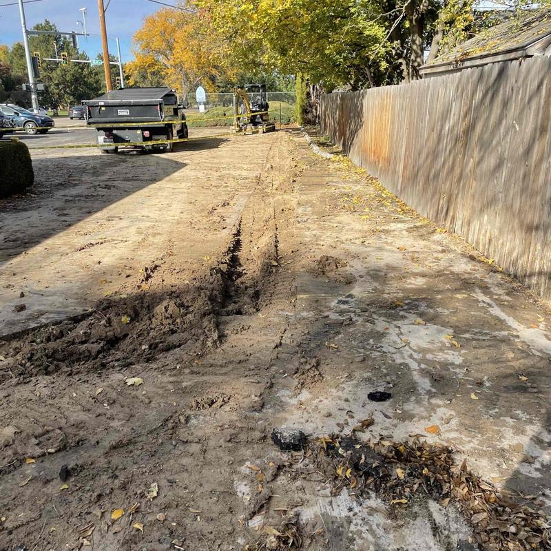 Sewer line trench excavation and asphalt sawcutting