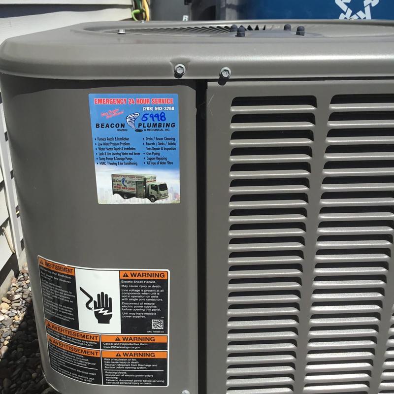 Air conditioning unit exterior with warning labels