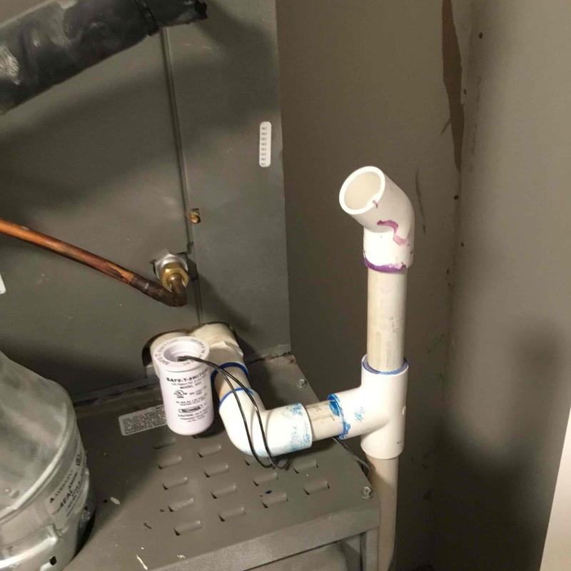 Furnace condensate drain pipe with safety switch wiring