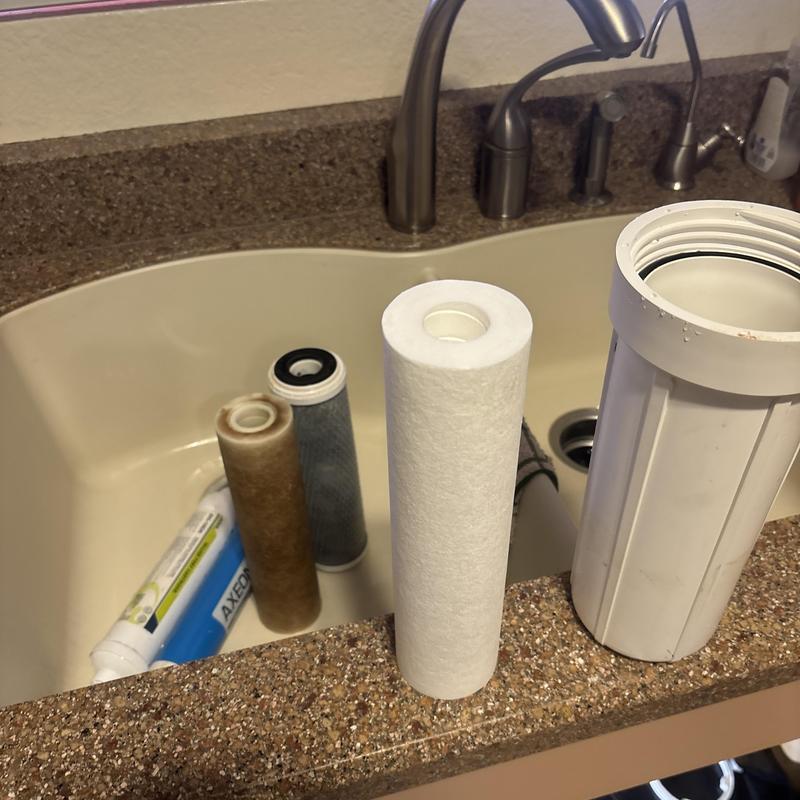 RO water filter cartridges and housing in kitchen sink RO water filter cartridges and housing in kitchen sink