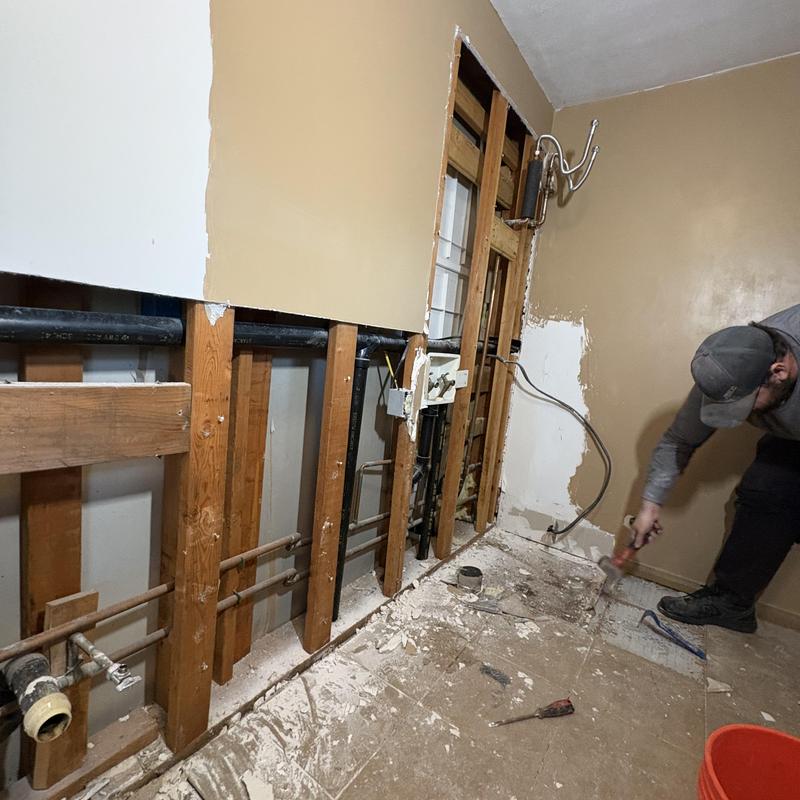 Electric tankless water heater installation in bathroom wall Electric tankless water heater installation in bathroom wall