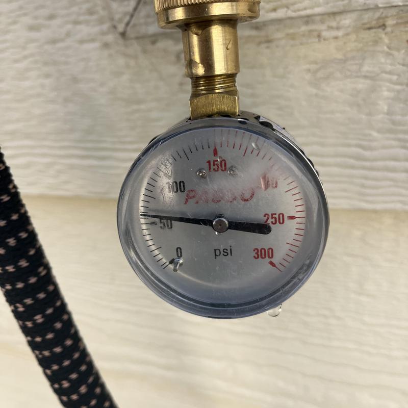 Pressure gauge on plumbing pressure reducing valve system