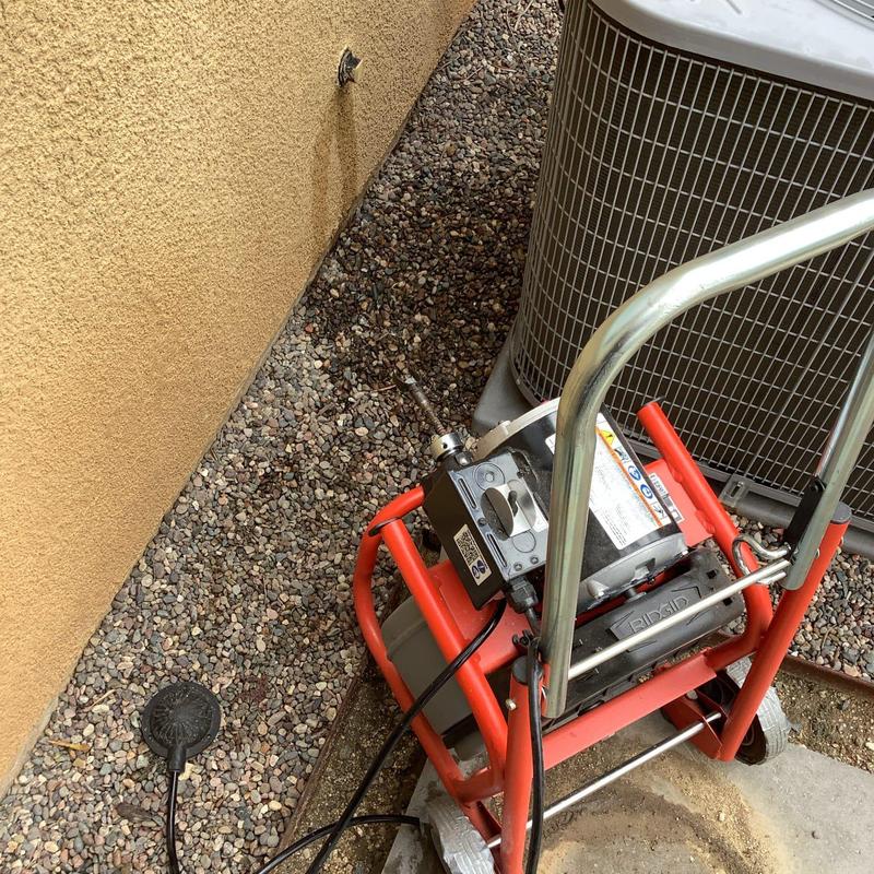 Electric drain snake clearing kitchen drain line blockage