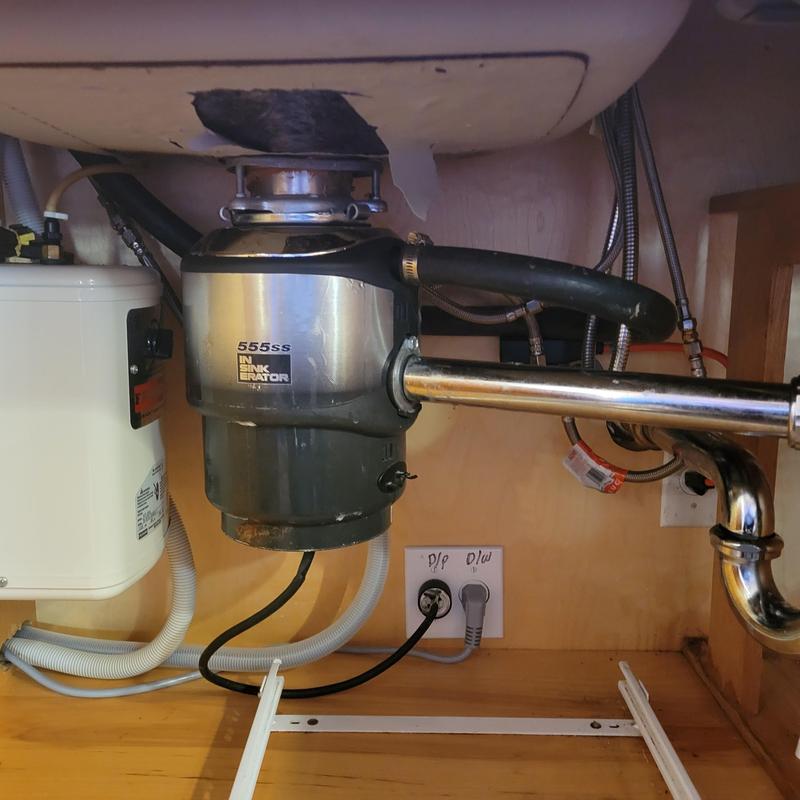Garbage disposal unit and kitchen sink plumbing setup Garbage disposal unit and kitchen sink plumbing setup