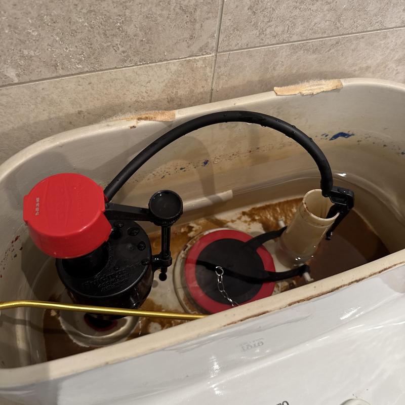 Toilet fill valve and flapper installation in tank Toilet fill valve and flapper installation in tank