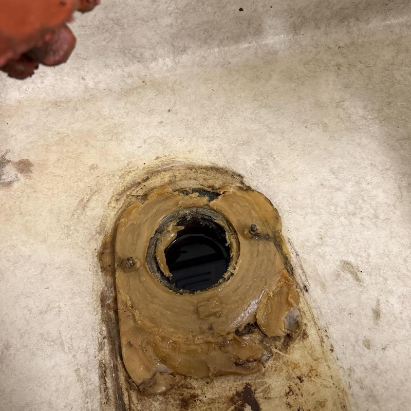 Toilet flange with old wax seal and corrosion Toilet flange with old wax seal and corrosion