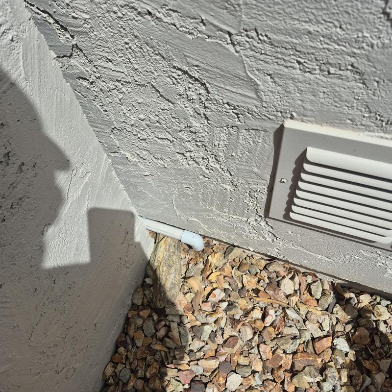 Tankless water heater condensate drain to rocks outdoors Tankless water heater condensate drain to rocks outdoors