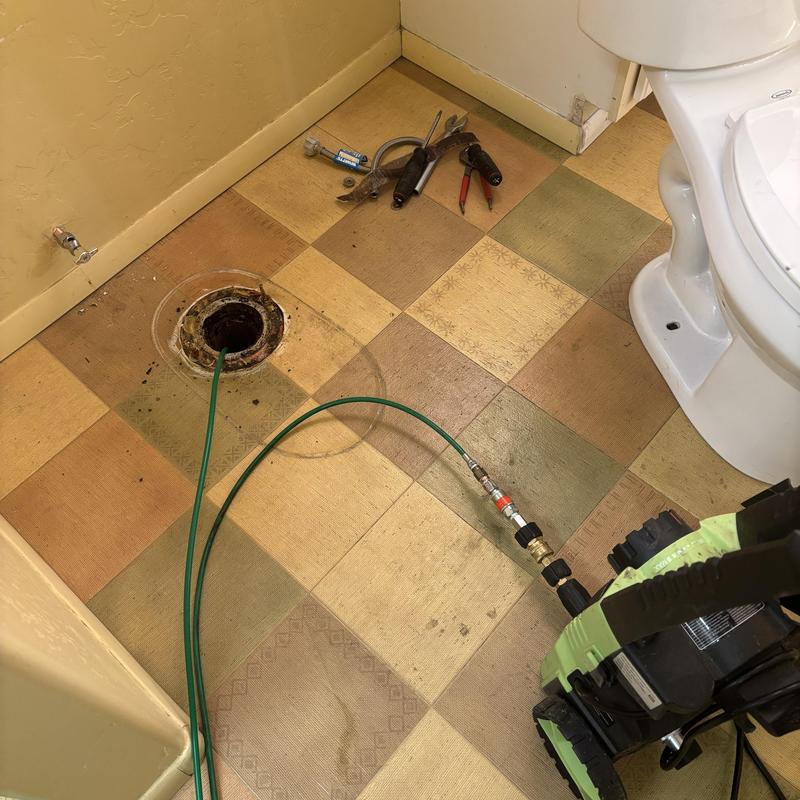 Toilet flange hydro jet cleaning with tools nearby Toilet flange hydro jet cleaning with tools nearby