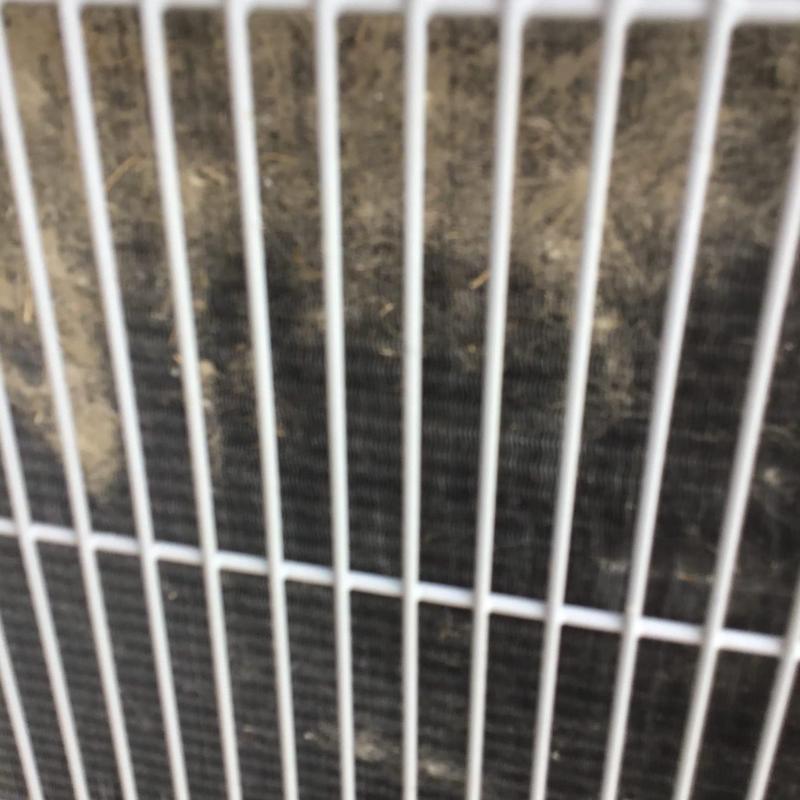 Outdoor air conditioner condenser coil clogged with dirt