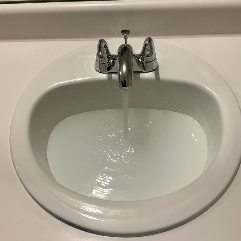 Bathroom sink faucet with running water Bathroom sink faucet with running water