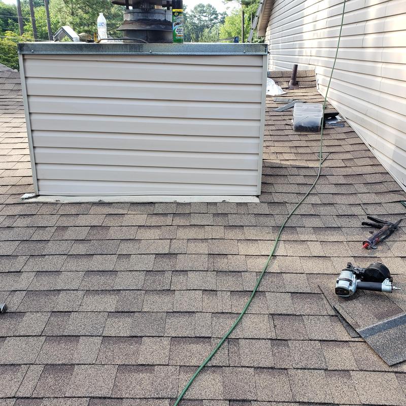 Architectural shingle roof with siding vent installation