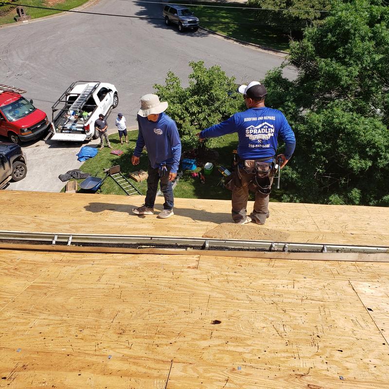 Plywood roof decking installation on residential roof