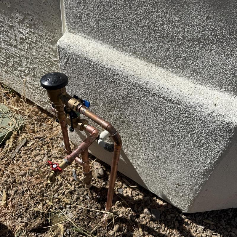 1” Copper Water Riser with Valve Assembly by House Wall 1” Copper Water Riser with Valve Assembly by House Wall