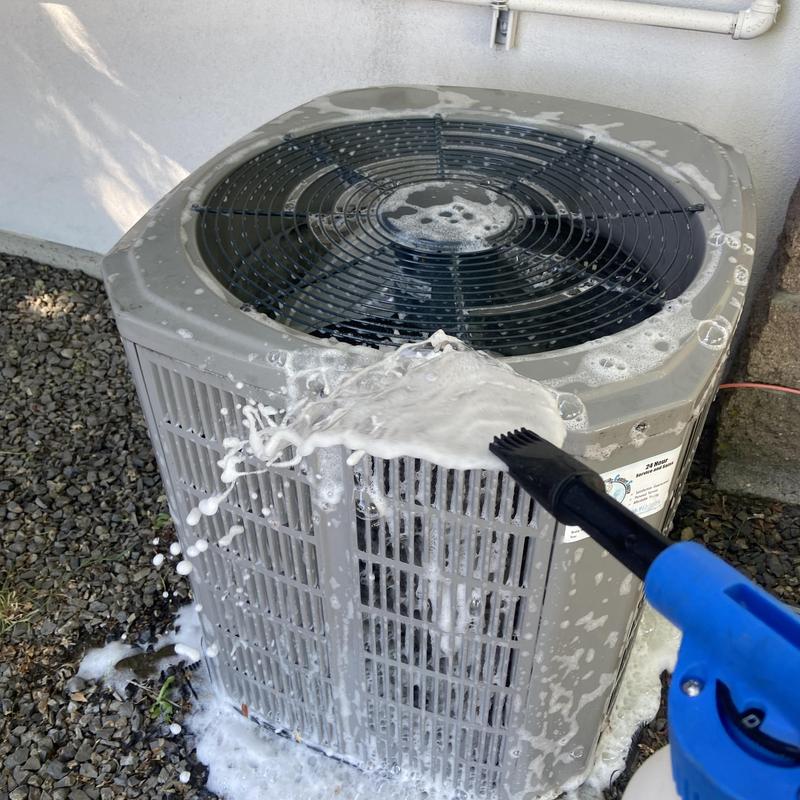 Outdoor air conditioner condenser cleaning with foam brush