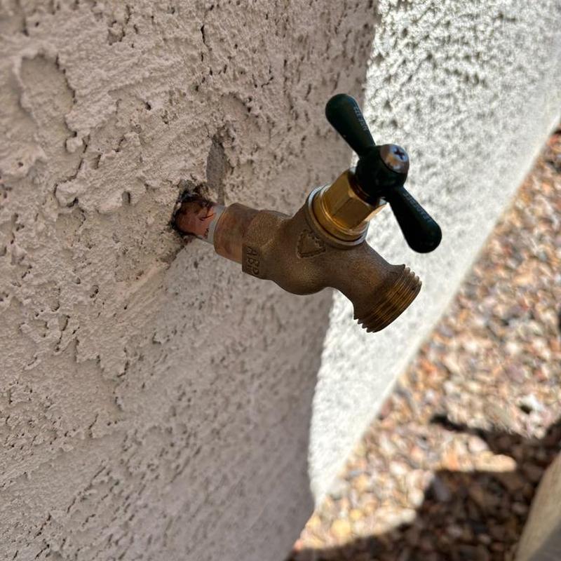 Hose bib valve installed on stucco exterior wall