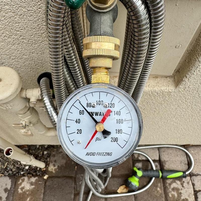 Water pressure gauge on irrigation system at 80 psi