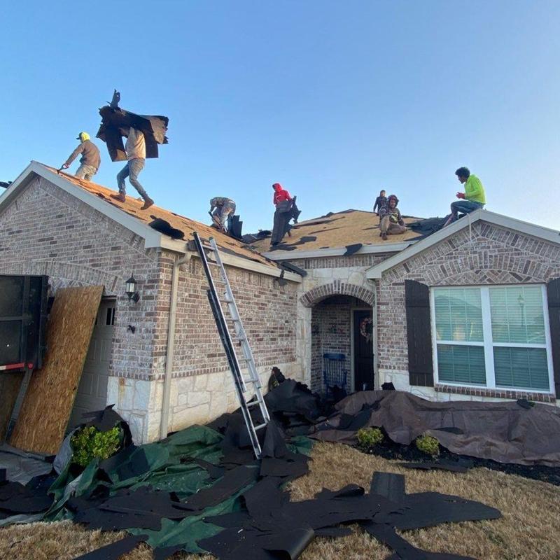 Roof shingles removal on brick home in Frisco, TX