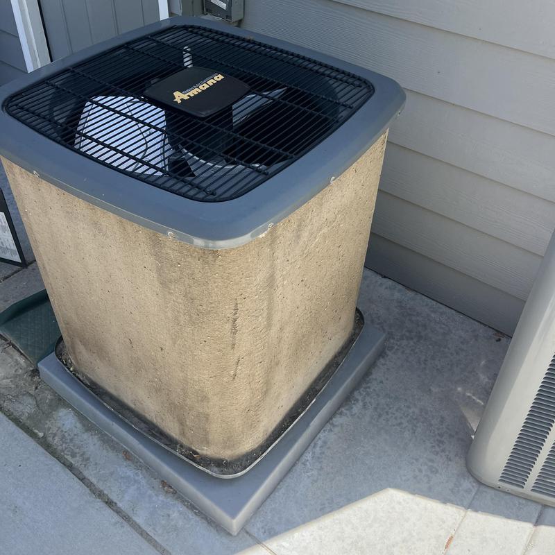 Amana outdoor AC unit with dirty protective cover