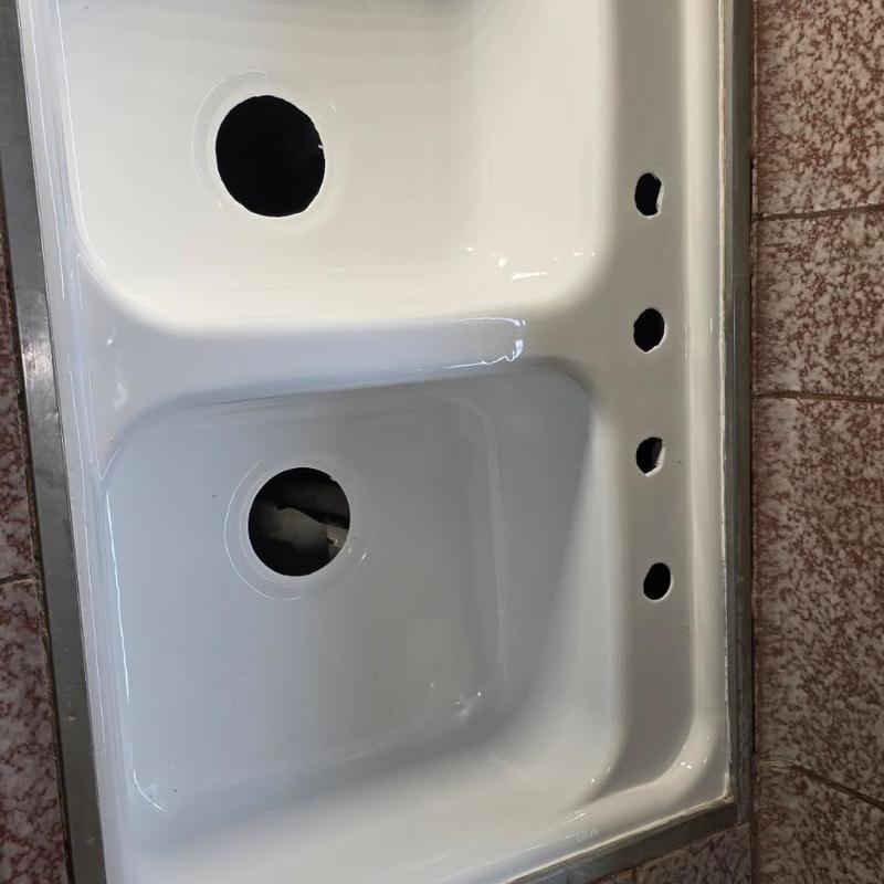 Kitchen sink with multiple faucet holes and drain openings