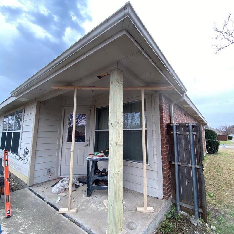 Back porch structural post with temporary bracing Back porch structural post with temporary bracing