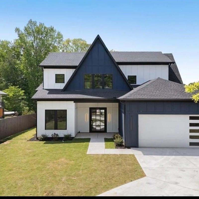 Asphalt shingle roof on modern farmhouse exterior