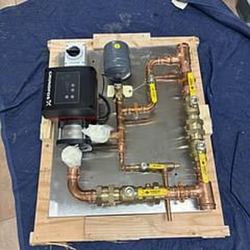 Booster pump and controller assembly with copper piping