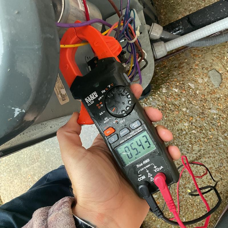 Electrical connections multimeter testing on HVAC system