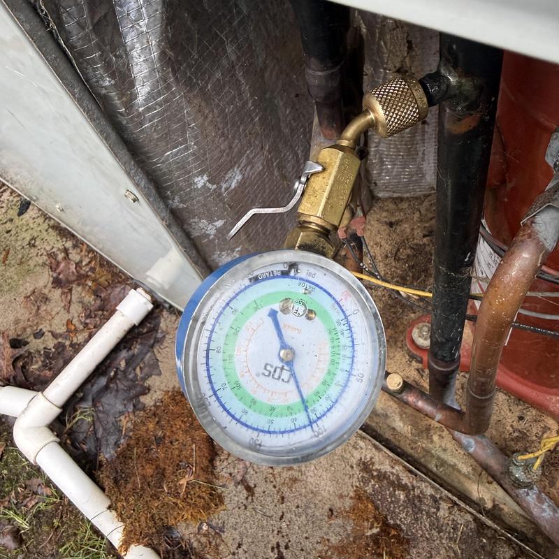 Refrigerant pressure gauge on HVAC condenser unit Refrigerant pressure gauge on HVAC condenser unit
