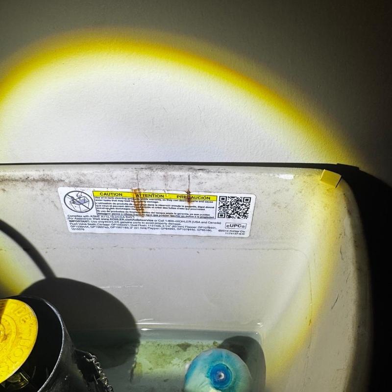 Toilet tank interior with sensor replacement estimate