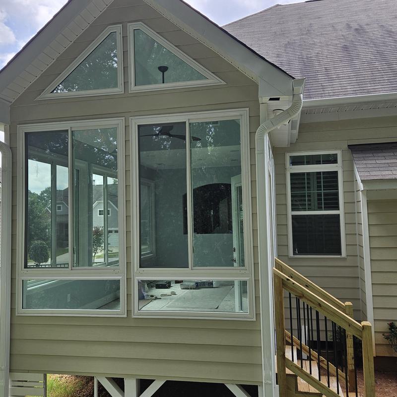 Home addition with large custom windows and siding