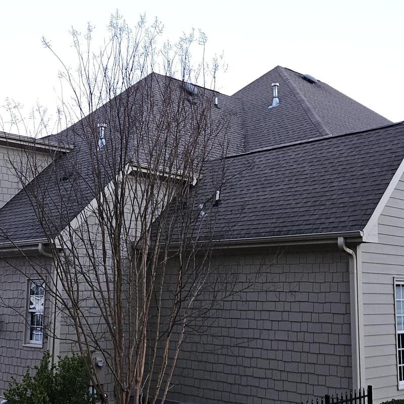 Asphalt shingle roof and siding on residential home