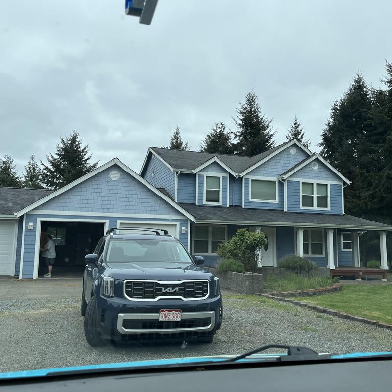 Roof shingles and exterior siding on two-story home