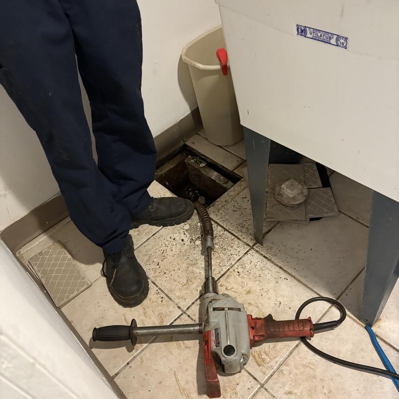 Main line drain cleaning with electric auger tool Main line drain cleaning with electric auger tool