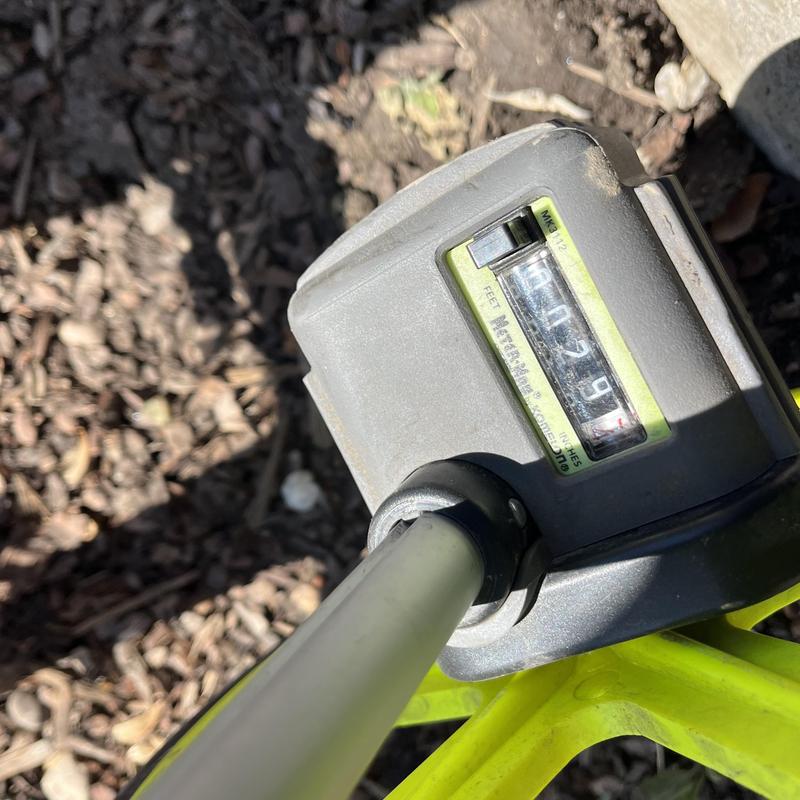 Water meter reading device attached to pipe outdoors