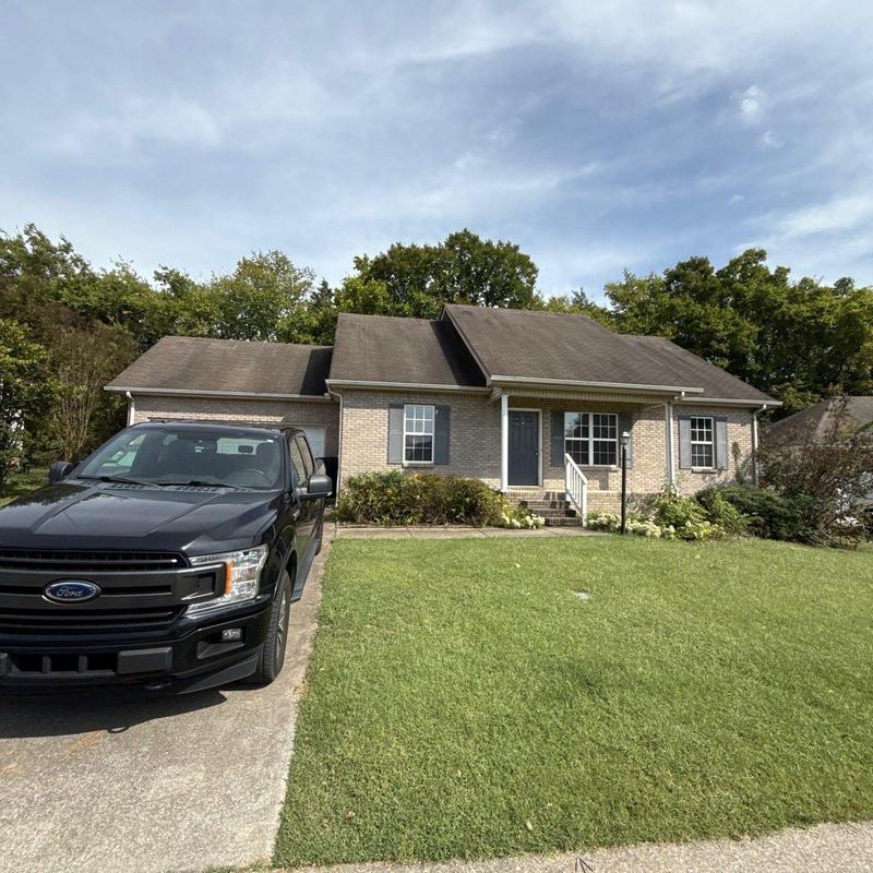 Asphalt shingle roof with hail damage inspection