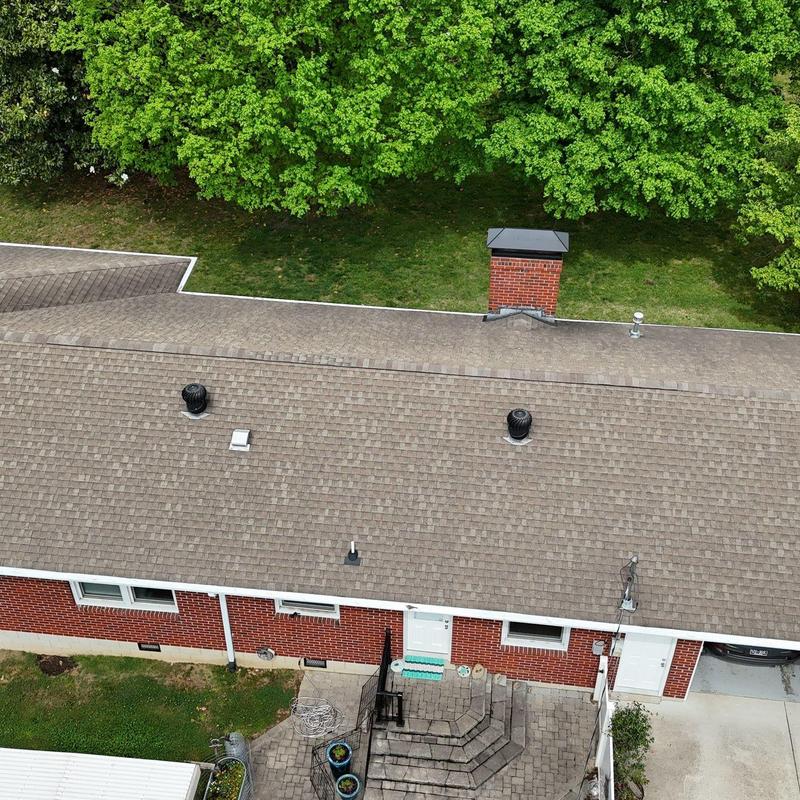 Asphalt shingle roof with ventilation and chimney