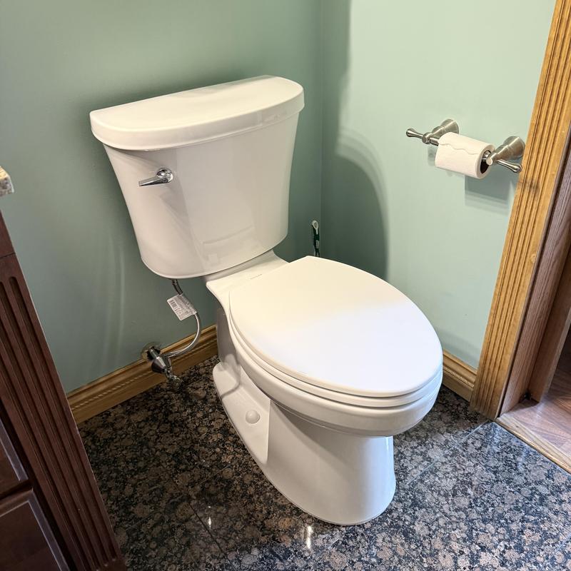 Toilet installation in bathroom with granite floor Toilet installation in bathroom with granite floor