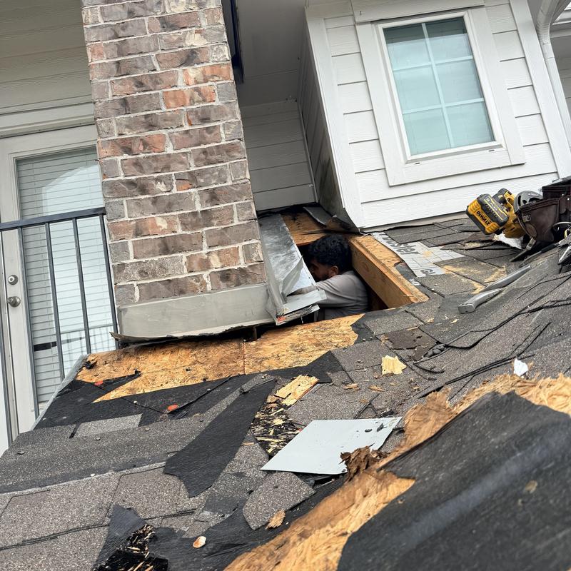 Chimney flashing and roof decking replacement in progress