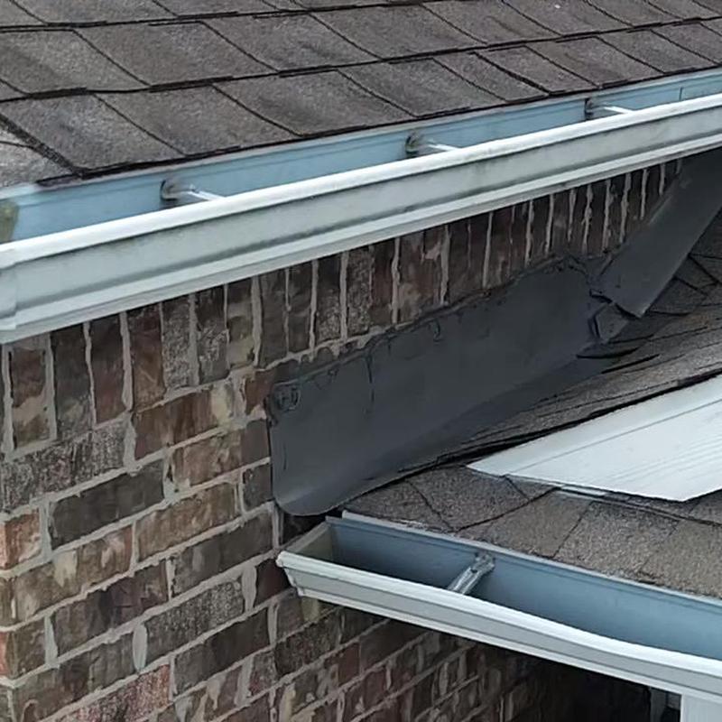 Wall flashing peeling off on shingled roof edge