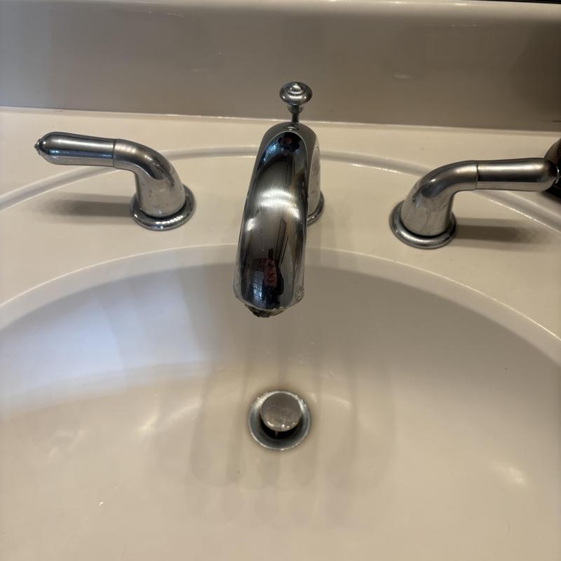 Bathroom sink faucet and handles on countertop Bathroom sink faucet and handles on countertop