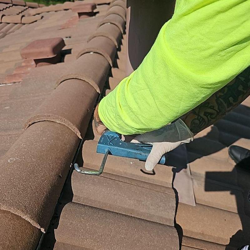 Tile roof ridge cap inspection with roof tuna tool Tile roof ridge cap inspection with roof tuna tool