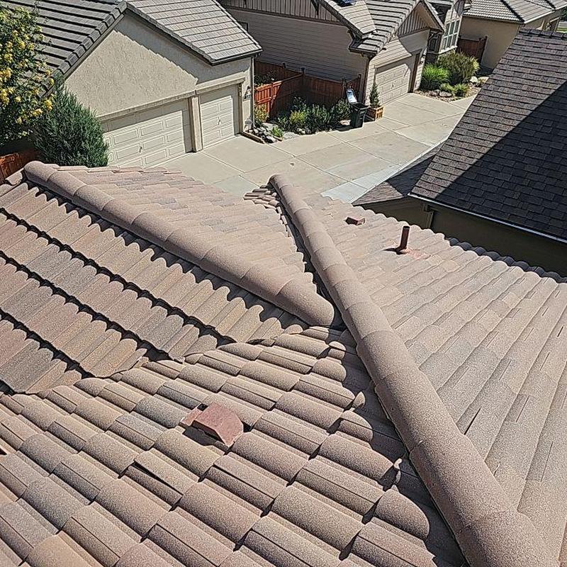 Tile roof with sealed penetrations and flashing Tile roof with sealed penetrations and flashing