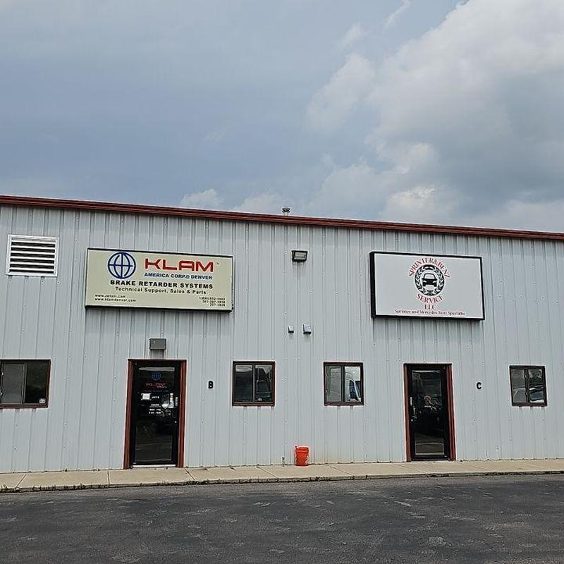 Metal building exterior with company signage Metal building exterior with company signage